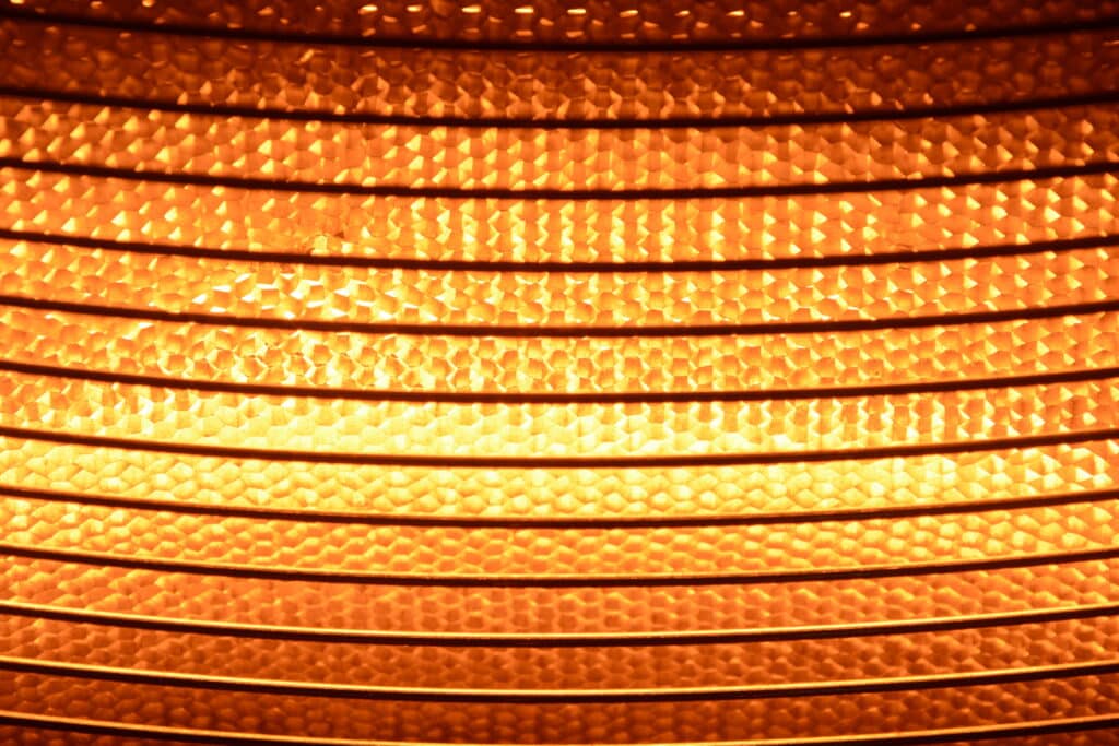 Close up of patio heating emitting orange light